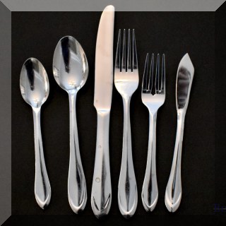K11. 47-Piece set of Cambridge stainless flatware. - $50